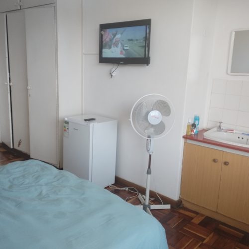 Bedroom with TV & fan